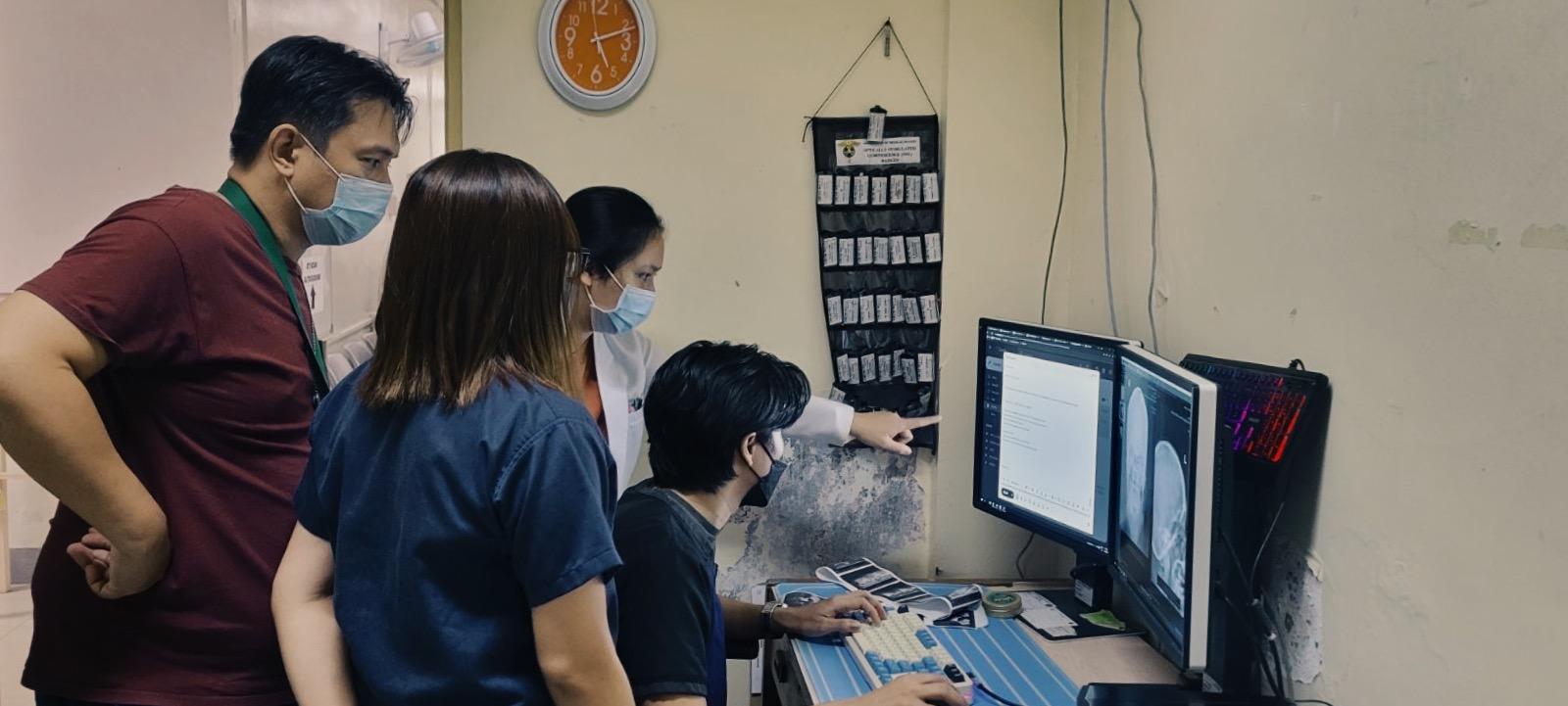 A clinician reviewing guidance before a consultation.