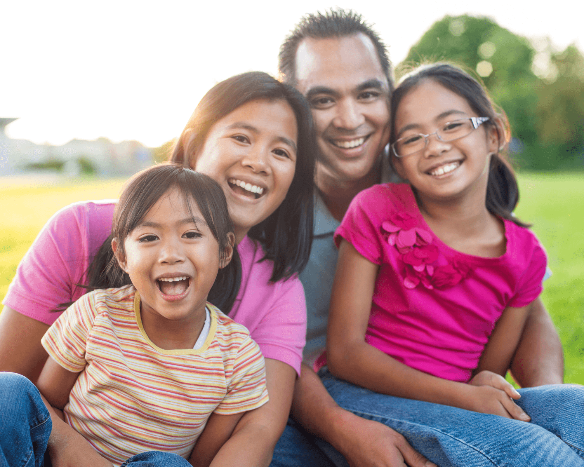 A Filipino family at home together during a video consultation.